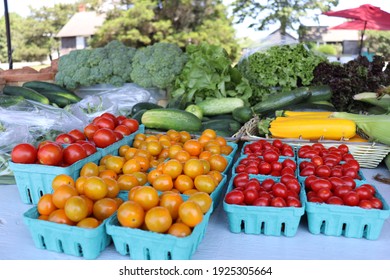 Ripe Tomatoes And Vegetables At Farm Stand  