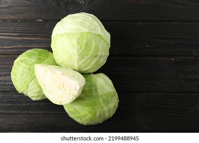 Ripe White Cabbage On Black Wooden Table, Flat Lay. Space For Text