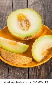 Ripe yellow sliced melon on plate - Shutterstock ID 754506712