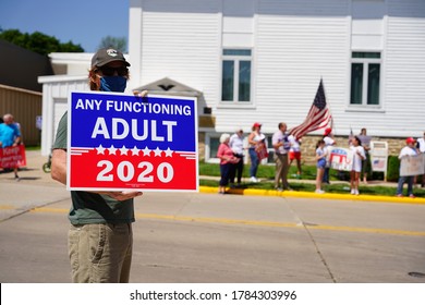 Ripon, Wisconsin / USA - July 17th, 2020: Supporters of the democratic party stand in protest against vice president mike pence gathering at ripon college.