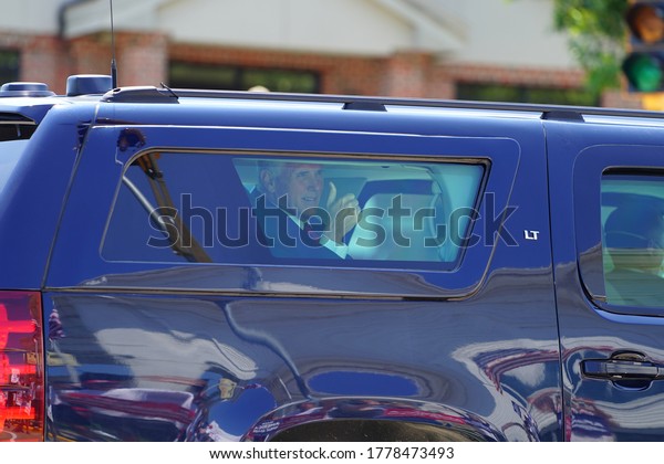Ripon,\
Wisconsin / USA - July 17th, 2020: Vice president mike pence giving\
a thumbs up to president trump supporters as he rides by in his\
motorcade when he stops at ripon college.\
