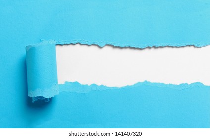 Ripped Blue Paper Over White Background