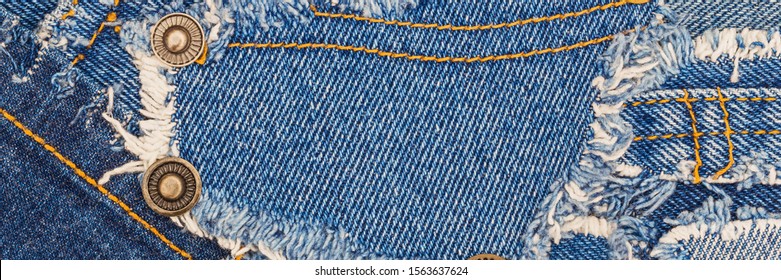 Ripped denim blue cloth background. Recycle old jeans denim concept. Destroyed torn denim blue jeans patches, banner