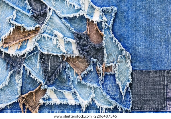 Ripped denim\
patch and destroyed torn denim blue scraps. Double color denim\
jeans fashion abstract\
background