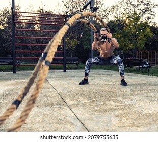 Ripped Guy Wearing A Fitness Mask Doing Cardio With Battle Ropes Outside, Battle Rope Concept