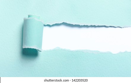 Ripped Light Blue Paper Over White Background