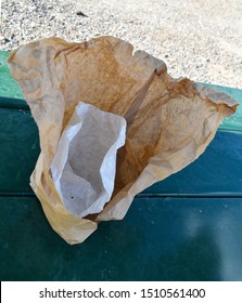 Ripped Open Empty Fast Food Bag Sack With Item Wrapper Inside