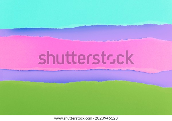 Ripped paper edge with copy space, multicolor\
background. Flat lay. Copy\
space.