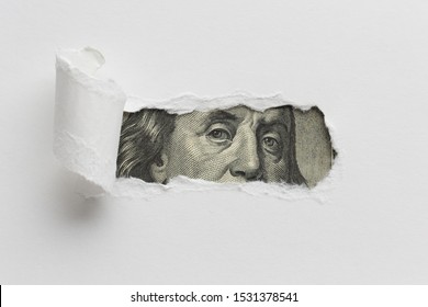 Ripped Paper Revealing Dollar Bill