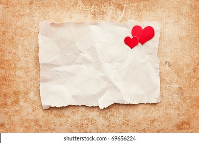 Ripped Piece Of Paper On Grunge Paper Background. Love Letter