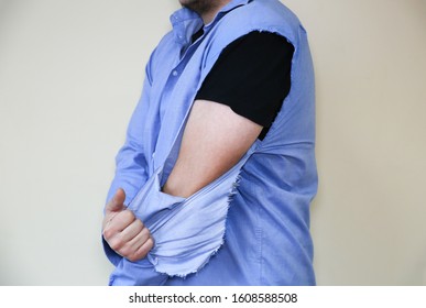 Ripped Shirt. Man In Old Clothes Which Need Repairing And Sewing.