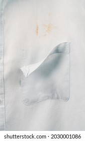 Ripped Shirt Pocket With Stain Marks