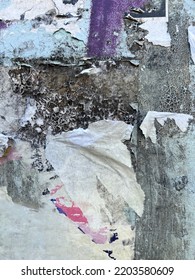 Ripped Tattered Weathered Street Poster Bits On Urban Concrete Wall 