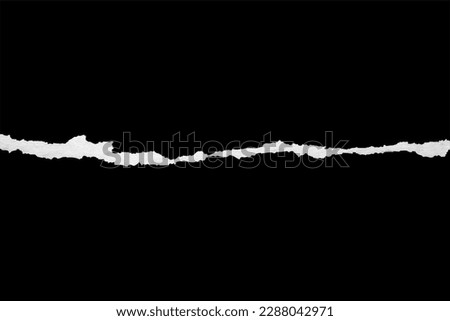 Ripped torn paper edges isolated on black background