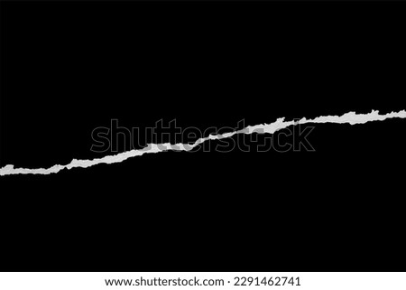 Ripped torn paper edges isolated on black background