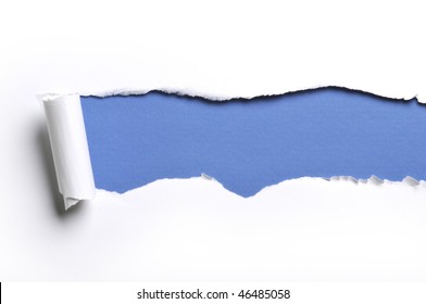 Ripped White Paper Against A Blue Background