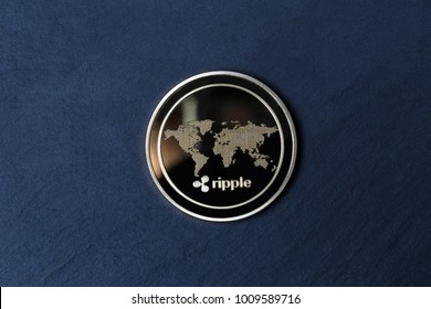 Ripple Coin On A Slate Plate Background