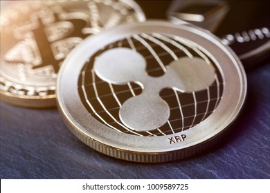 Ripple Coin And Other Crypto Coins On A Slate Plate