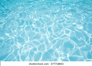 Ripple Water Surface And Sun Reflection In Swimming Pool