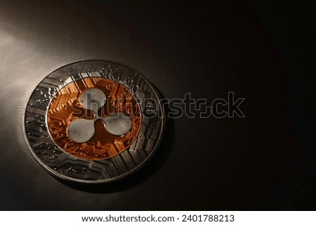 ripple or xrp crypto-currency coin with innovation  blockchain Payments, trade in goods and financial transactions, international , silver crypto currency coin  ripple or XPR on gray and brigh