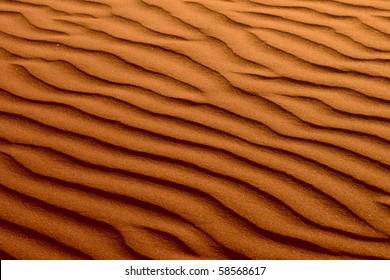 Rippled Golden Brown Beach Sand Texture Background