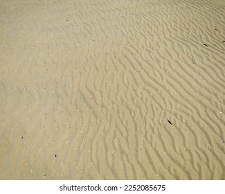 Rippled sand waves on the beach - Shutterstock ID 2252085675