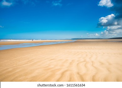 Ripples in the sand caused by the tidal movement of the sea on Holkham bay beach, North Norfolk coast, East Anglia, England, UK. - Powered by Shutterstock