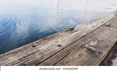 Rippling Lake At The Edge Of The Dock
