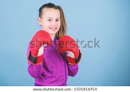 Rise of women boxers. Girl cute boxer on blue background. With great power comes great responsibility. Contrary to stereotype. Boxer child in boxing gloves. Female boxer change attitudes within sport.