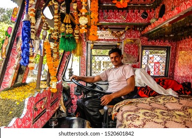 Rishikesh, India - Circa April 2018. Indian Truck Driver Inside The Cockpit.