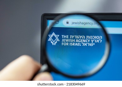 Rishon Lezion, Israel – 25 July 2022. The Jewish agency for Israel website under magnifying glass. Concept of political crisis between Israel and Russia. Sohnut company closure sanctions issue.