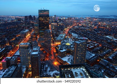 A Rising moon over the city of Boston