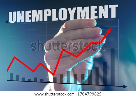 Rising unemployment during recession. Economic crisis has led to unemployment. Man depicts a graph. Growing graph is drawn on glass. Stylus in the hand. Large Aplan unemployment logo. Labor market.