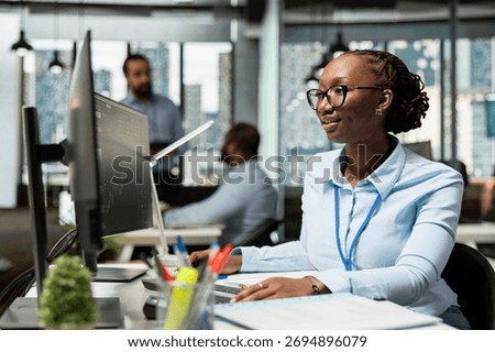 Risk analyst in office using PC to evaluate trading strategies, minimizing losses. African american woman in prop firm using data reports to assess volatility in financial markets