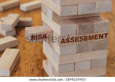 Risk assessment concept using wooden blocks