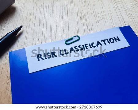 Risk classification writting on table background. 
