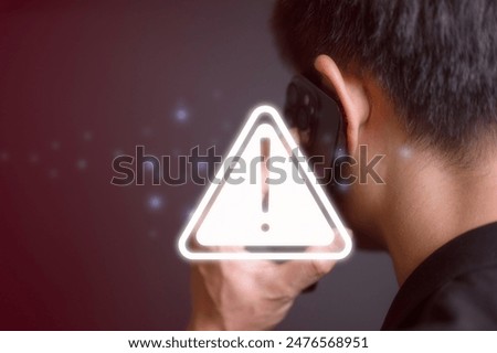 risk and cyber security technology concept man holding mobile phone with alert warning triangle sign showing to be careful with fraudulent Abort connection internet security