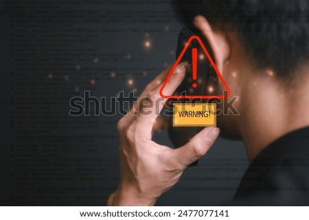 risk and cyber security technology concept man holding mobile phone with alert warning triangle sign showing to be careful with fraudulent Abort connection internet security