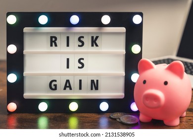 Risk Is Gain Motivational Phrase On Marquee Lightbox - Self Development Concept. High Quality Photo