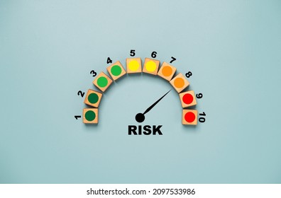 Risk level indicator rating print screen wooden cube block since low to high on blue background for Risk management and assessment concept. - Shutterstock ID 2097533986