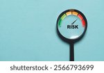 Risk level indicator rating since low to high inside of magnifier glass for Risk management and assessment concept.