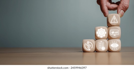 Risk management concept, Hand holding wooden block on desk with risk management icon on virtual screen. - Powered by Shutterstock