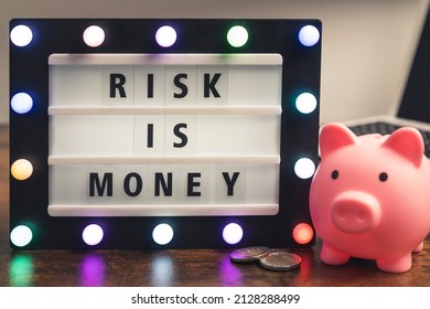 Risk Is Money Motivational Phrase On Marquee Lightbox - Self Development Business Concept. High Quality Photo