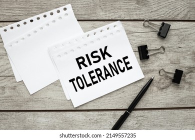 Risk Tolerance. Text On Pages From Notepad On Desktop