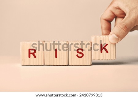 Risk word written on wooden cubes.