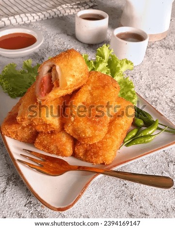 Risoles, or commonly called risol, are pastries filled with meat, usually minced meat, and vegetables wrapped in an omelette, and fried after being coated with breadcrumbs and beaten chicken egg.