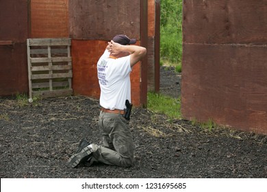 RITTMAN, OH - JUNE 19, 2014. An Attendee Pretends To Be A Hostage At The Three-day FASTER Training For School Employees.