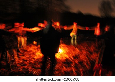 Ritual dances near camp fire at night
