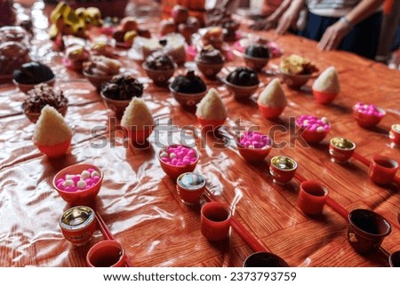 Ritual offerings to deity on a temple altar, wine, tea, rice and meat. Chinese sacrificial ceremonies for traditional festivals. 
