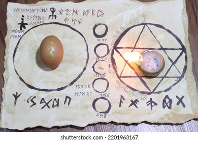Ritual to remove curses using eggs On a piece of paper the wizard's insignia The runes in the picture represent the spells used in this ritual. This image is suitable for an article about magic. - Shutterstock ID 2201963167